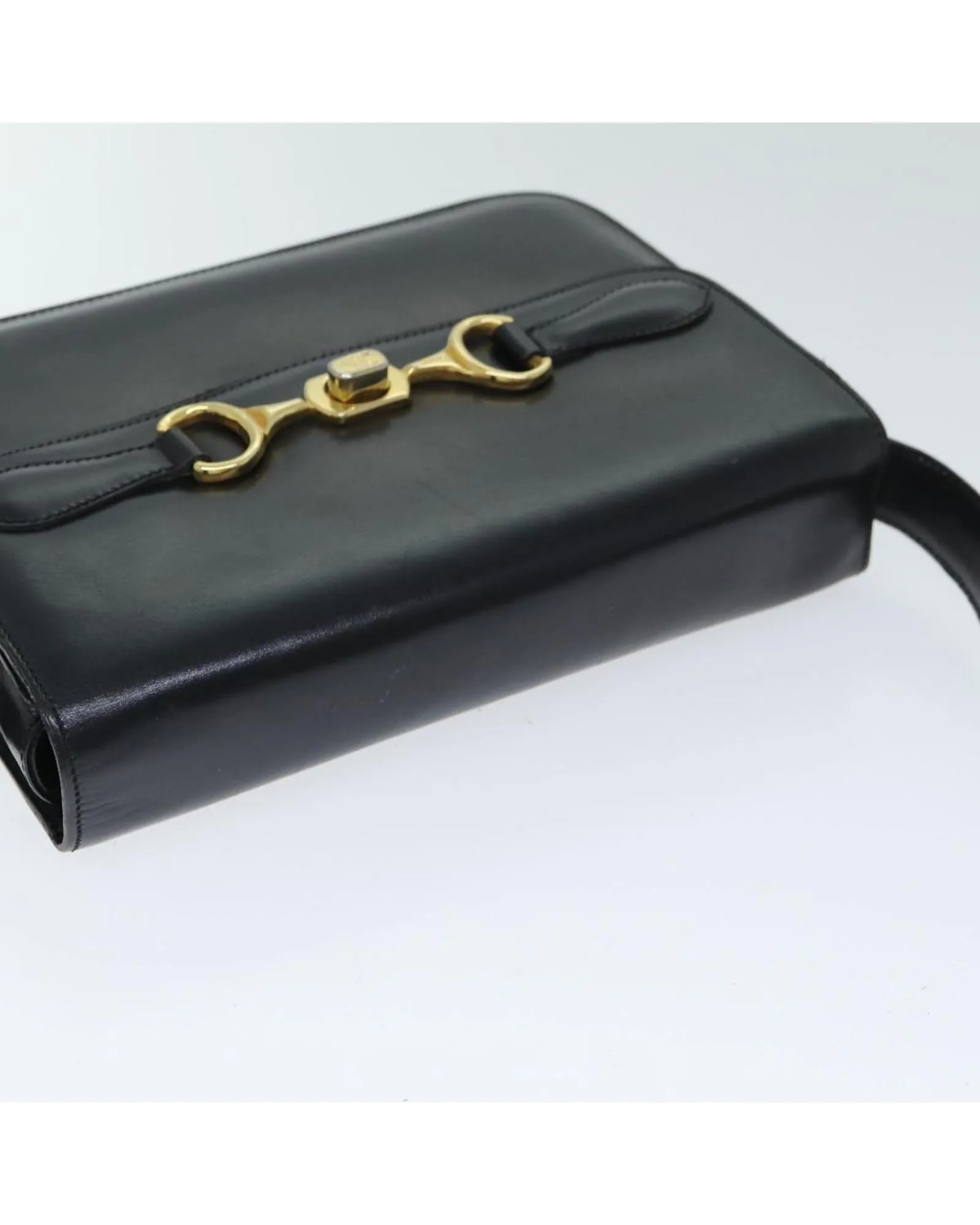 Leather Shoulder Bag with Adjustable Strap and Vintage Detailing