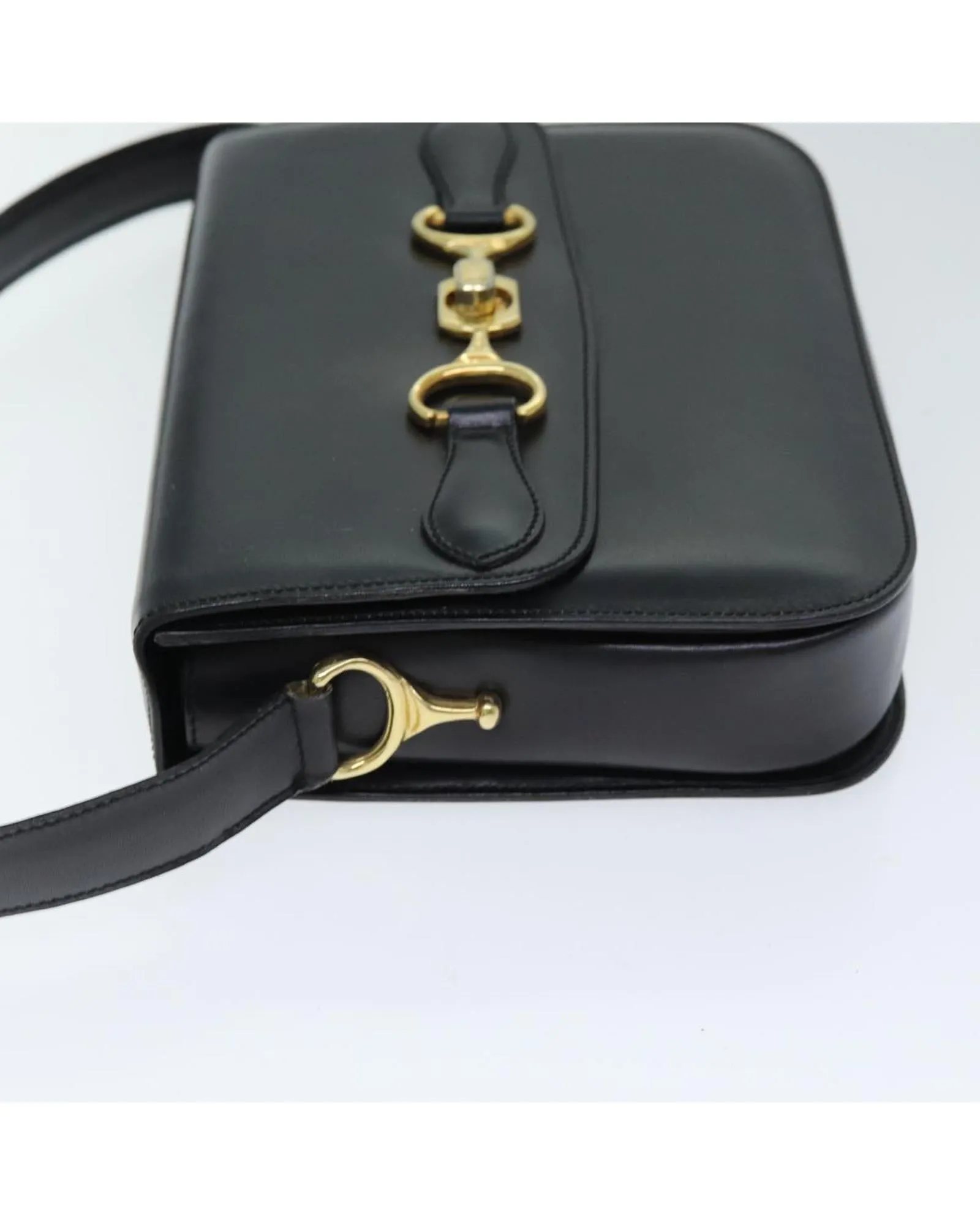 Leather Shoulder Bag with Adjustable Strap and Vintage Detailing