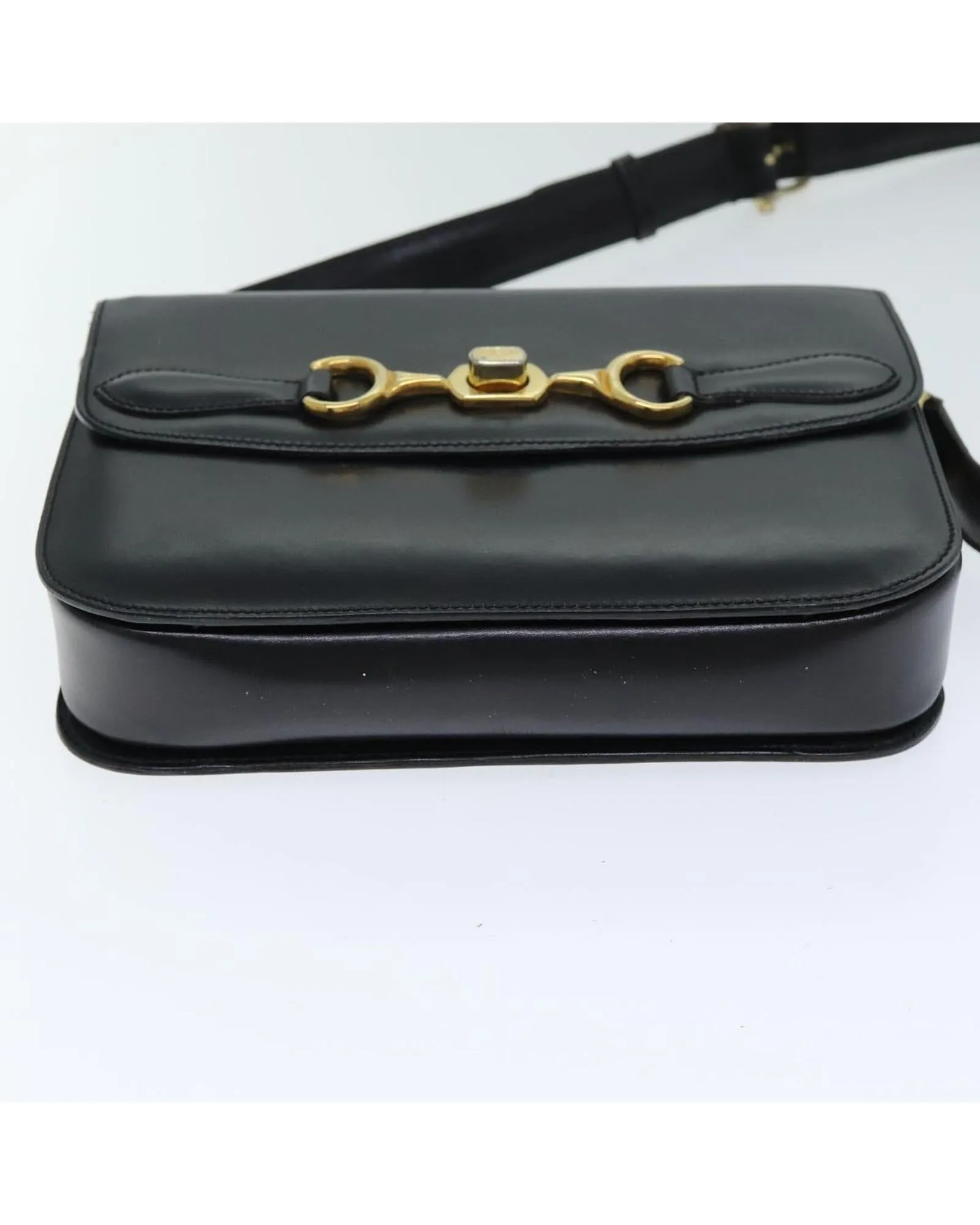 Leather Shoulder Bag with Adjustable Strap and Vintage Detailing